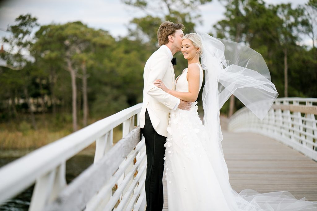 bride and groom portrait on bridge