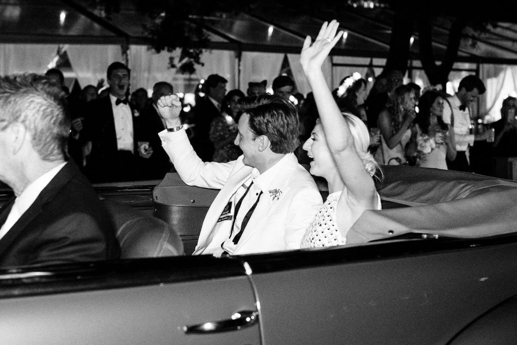 Wedding exit in vintage car