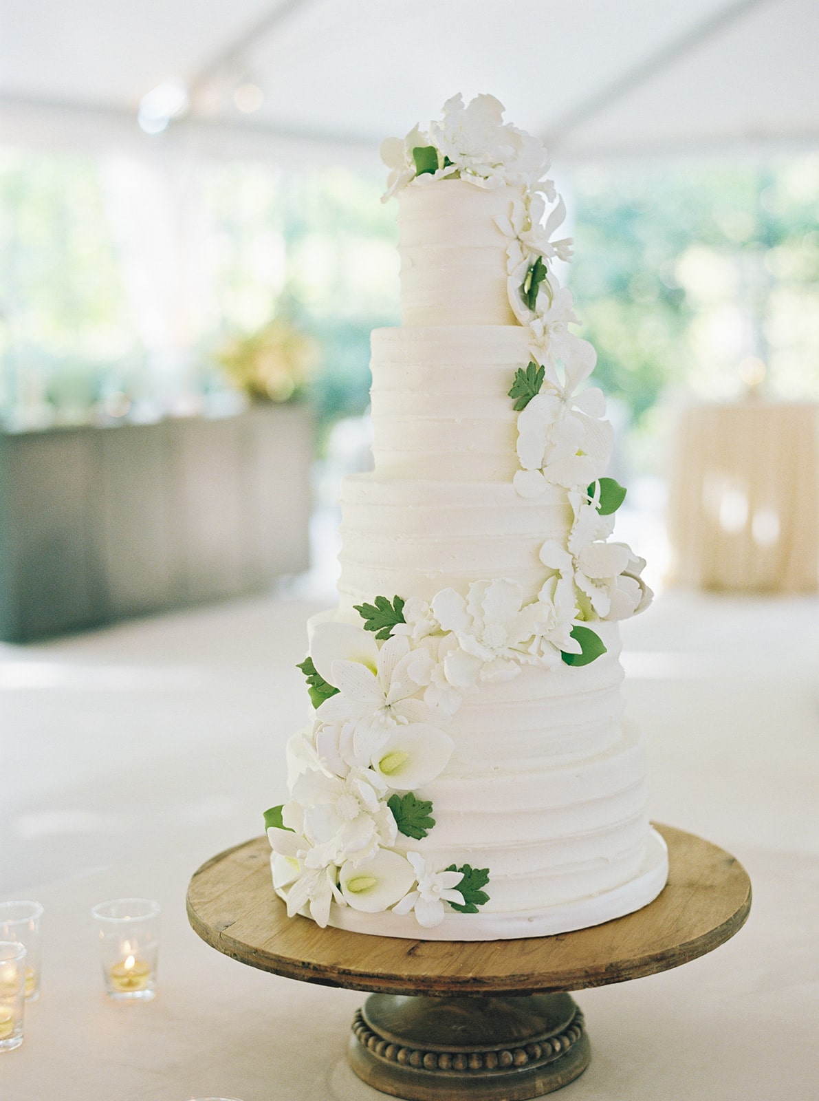 Four tiered butter cream wedding cake