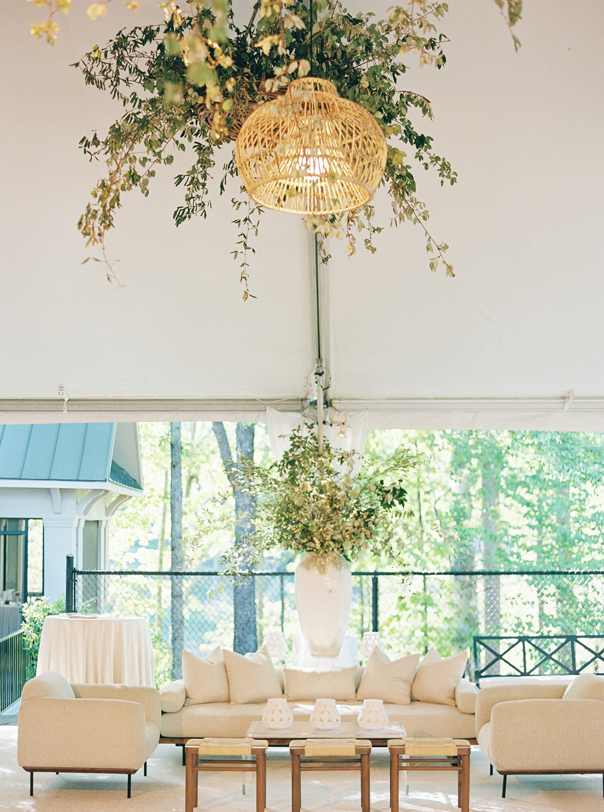 Tented wedding reception with white lounge