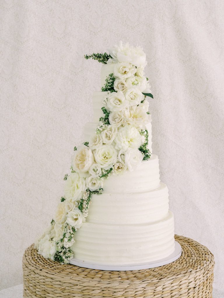 Luxury butter cream wedding cake with white flowers