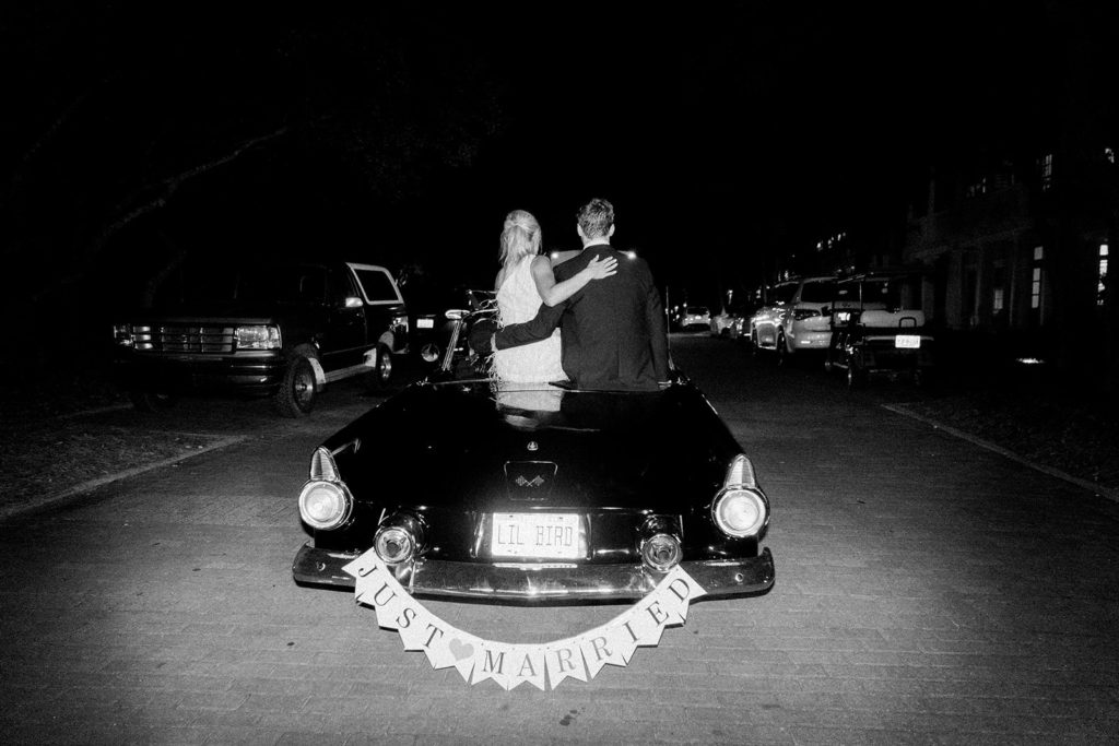 Vintage wedding car exit in black and white