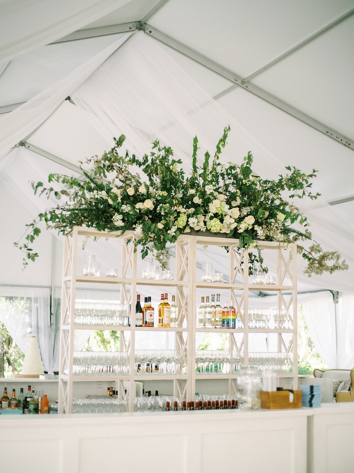 White wedding bar with large floral display