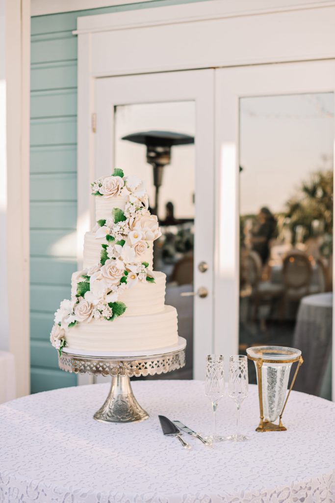 Four tiered wedding cake with flowers