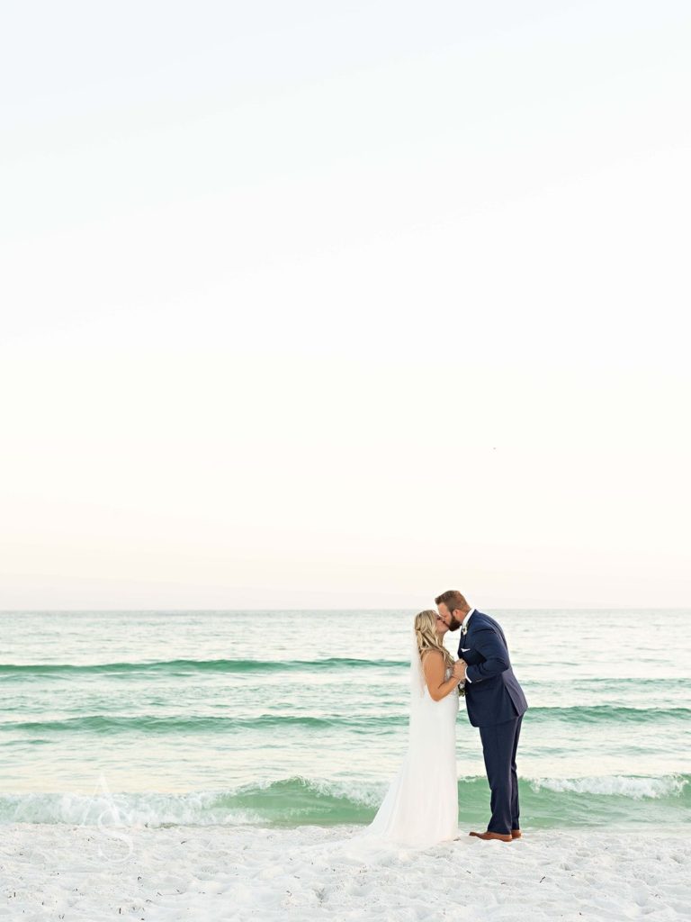Florida bride and groom kissing on a beach