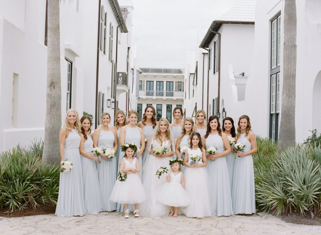 Bridesmaids in long dusty blue bridesmaid dresses