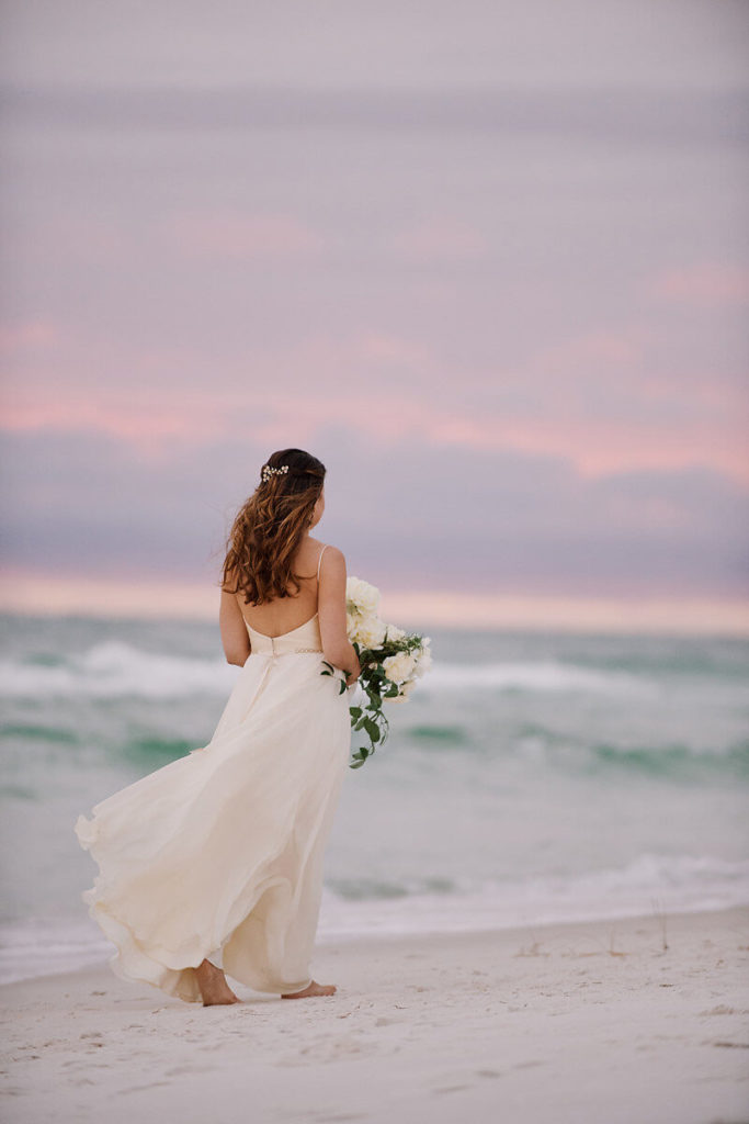 Brides back walking on beach