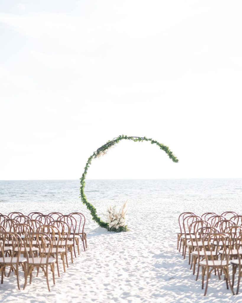 Cresent wedding arch on the beach