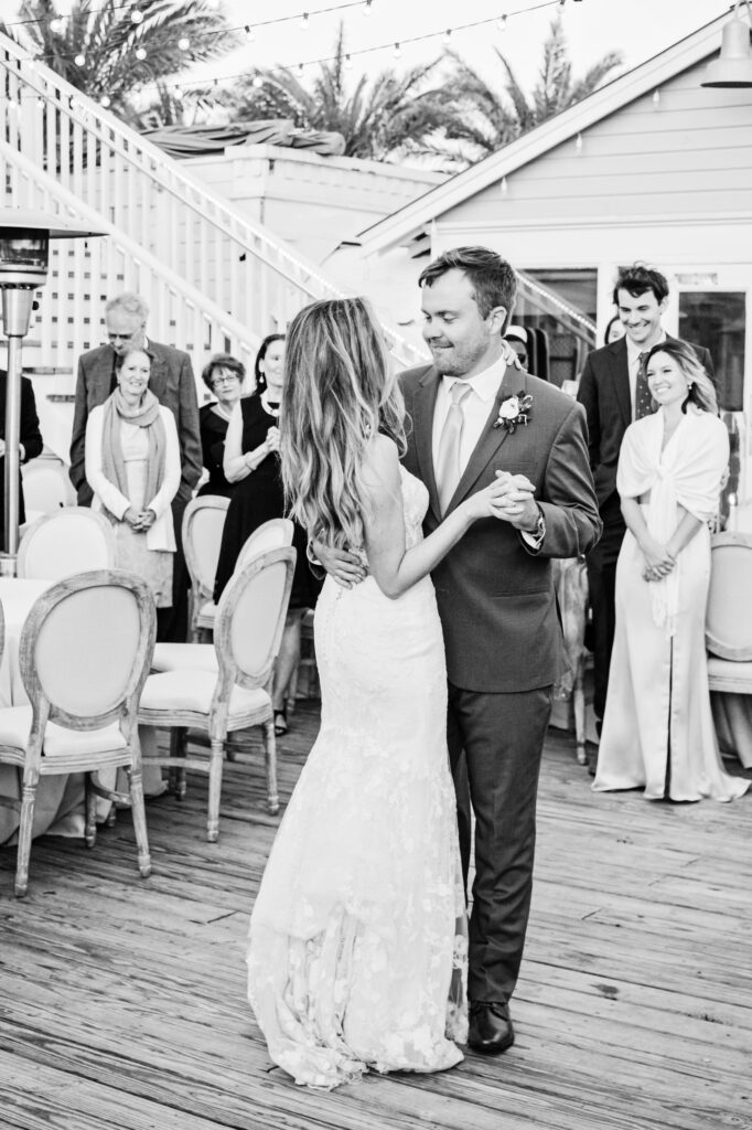 Black and white photo of bride and groom first dance