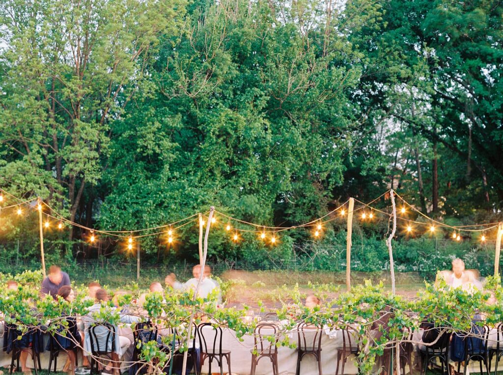 wedding table in a garden with bistro lights